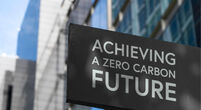 Achieving a zero-carbon future in front of a modern office building