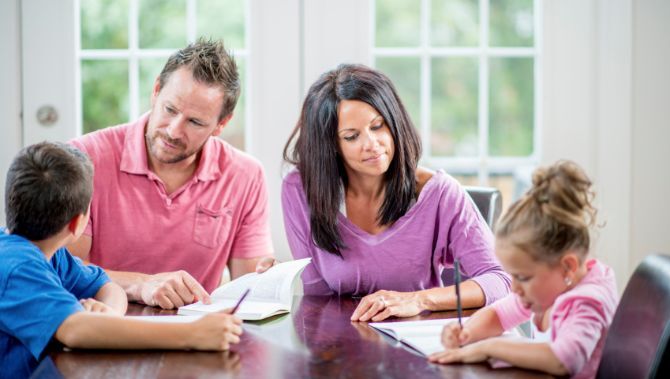 Parents helping kids with schoolwork