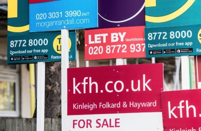 UK house prices growth continues to stutter - for sale signs
