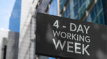 4 - Day working week on a black city-center sign in front of a modern office building