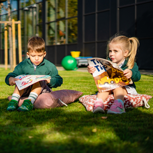 Cambridge-School-of-Bucharest-young-children-reading-outdoors