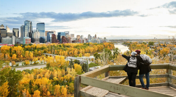 A couple overlooking the city of Calgary, Canada