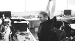 Happy employee stretching at desk