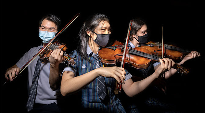 AIS Singapore students playing violin