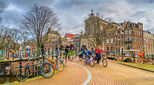 view on the group of cyclists in the historic centre of Amsterdam
