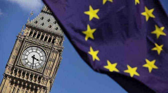 EU flag flying in front of Big Ben at UK Parliament in London