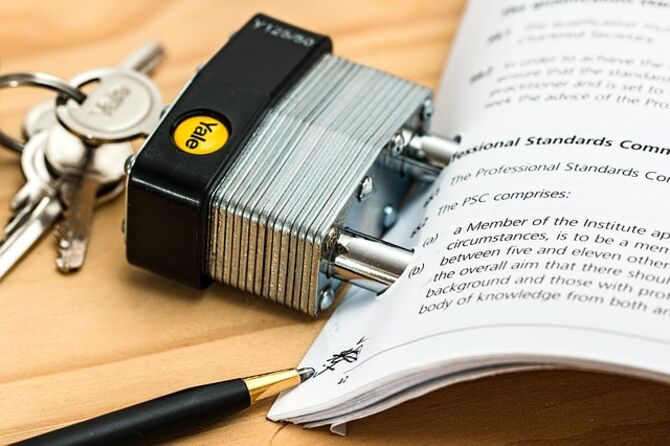 Padlock and keys on paperwork