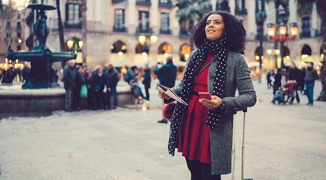 A woman waits in a Barcelona square