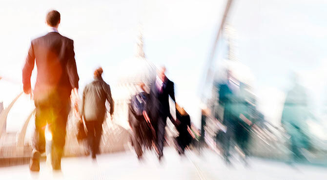 In the wake of brexit people walking different directions over bridge london