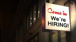 Sign saying "come in, we're hiring"