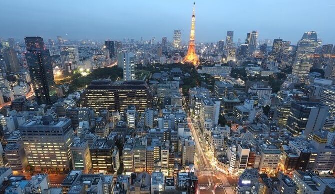 Dusk in Paris with office buildings and the Eiffel Tower illuminated