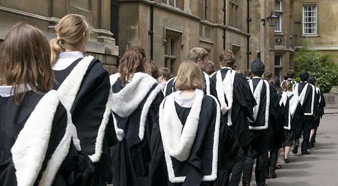 Graduands from Clare College Cambridge process to their graduation ceremony