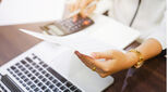 Close up of female accountants deskwork