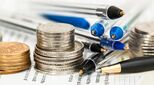 Image of pile of pens and coins