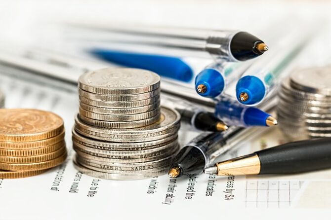 Image of pile of pens and coins