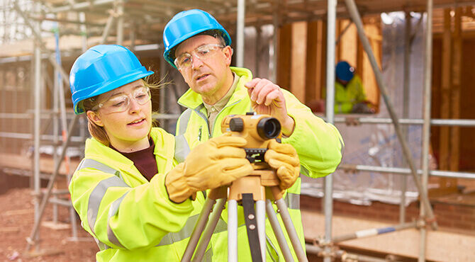Construction apprentice with tutor