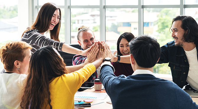 Photo of engaged and upbeat millennial workers