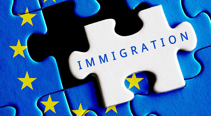 EU flag with the word immigration as a puzzle piece