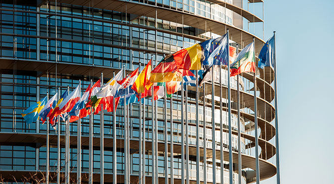EU parliament with flags flying