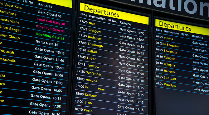 Image of a UK airport departure board illustrates an article which discusses the fact that many EU workers are contemplating leaving the UK