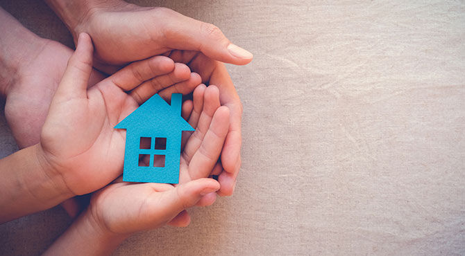 Family: Parent supporting child's hands