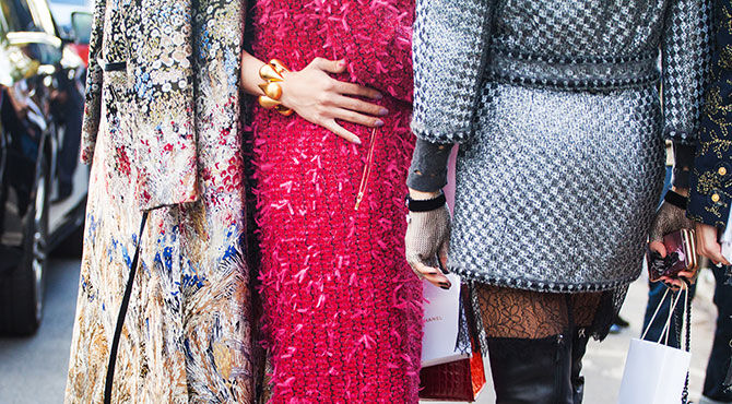 Image of two women wearing stylish outfits to illustrate an article about the fashion industry