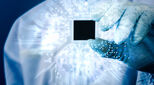 Image of a hand holding a microchip illustrating an article about Fintech investment