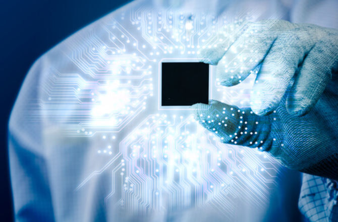 Image of a hand holding a microchip illustrating an article about Fintech investment