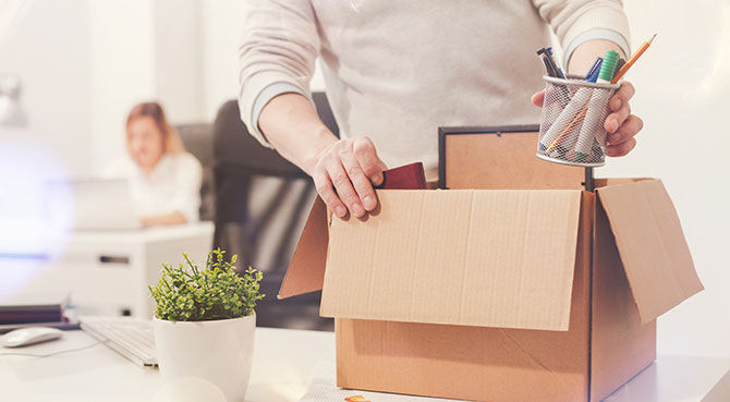 Employee packs up desk