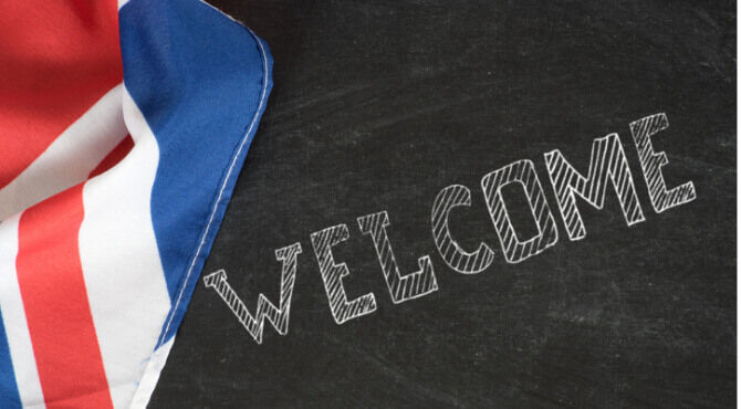 Chalkboard with Union flag and word welcome written on the board