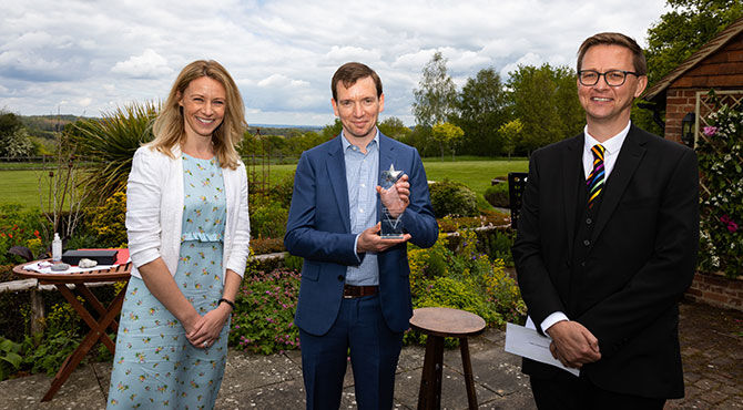 Ian Robinson and Louise Haycock, Fragomen Partners, seen here with awards judge Paul Williamson