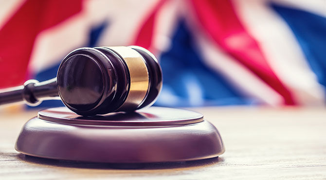 Gavel in front of a UK flag