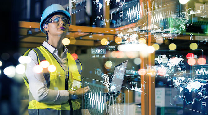 Female engineer in hard hat looks upwards