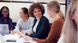 Image of happy coworkers led by women