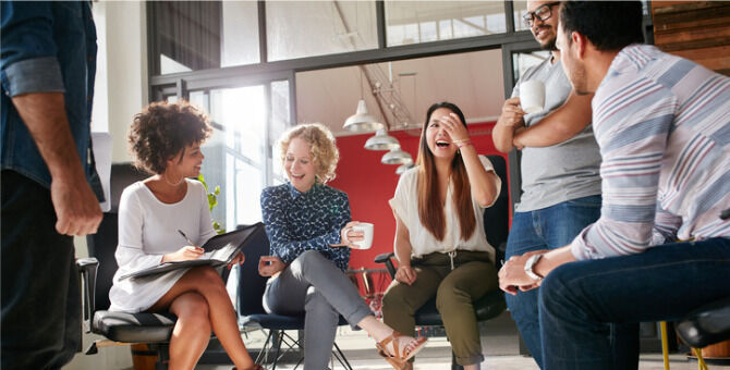 Shot of a group of young business professionals having a meeting. Diverse group of young designers smiling during a meeting at the office.