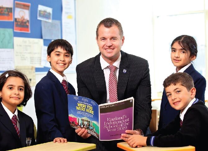 image of Brighton College Dubai headmaster and students