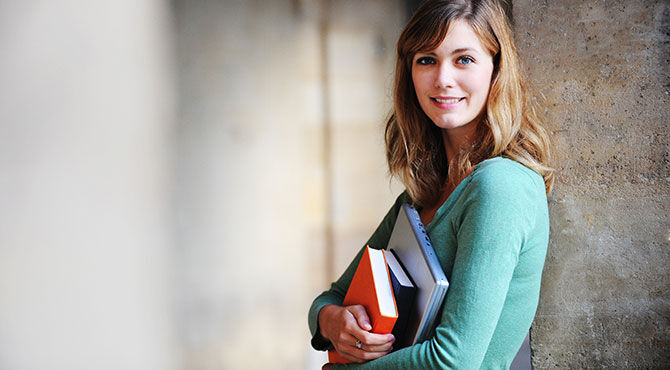 A university student with her books