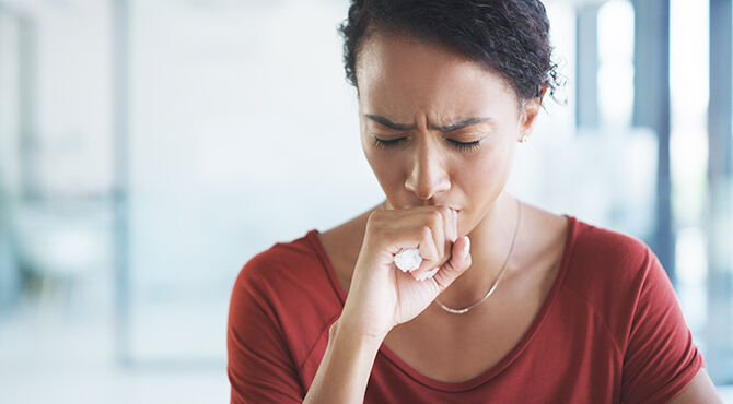 ill woman in office coronavirus