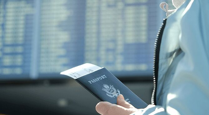 Hand holds a passport