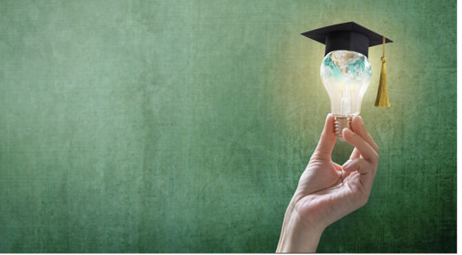 Image of lightbulb with globe and mortar board on top