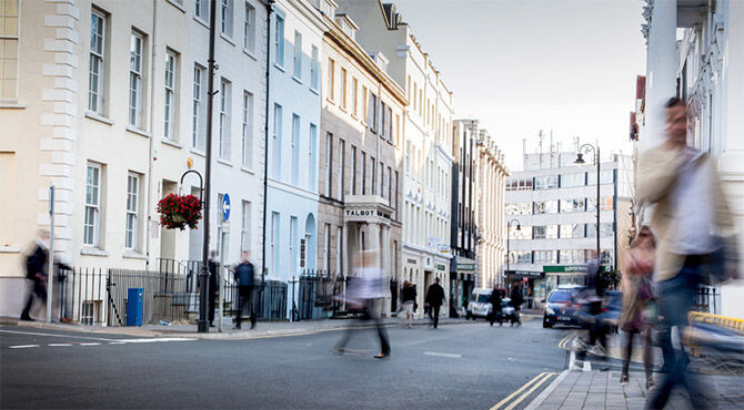 Image of workers walking down a street