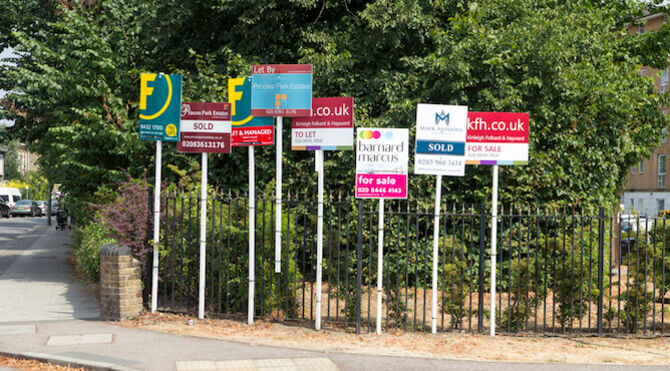 Row of For Sale signs in London street