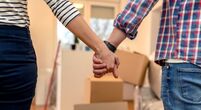 stock-image-couple-holding-hands-moving