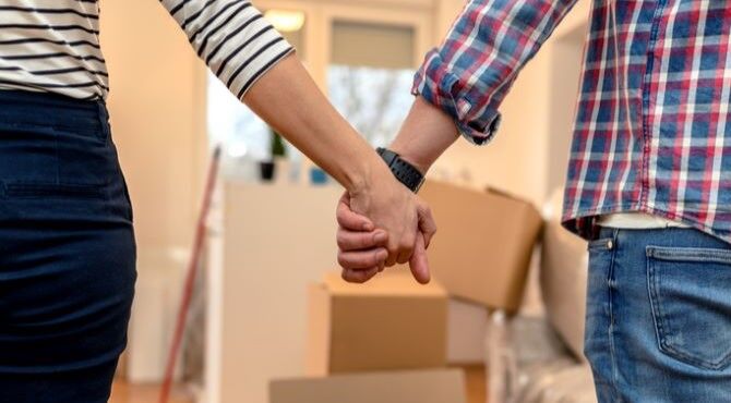 stock-image-couple-holding-hands-moving