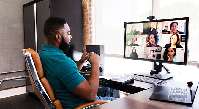 A-mid-adult-manager-video-conferences-with-his-team