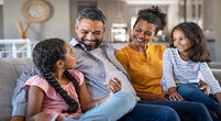 Family smiling at home