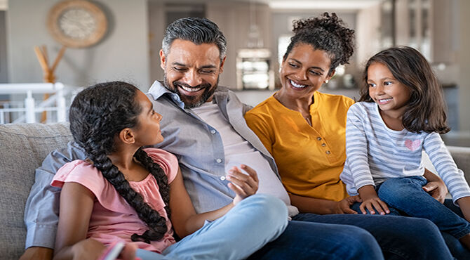 Family smiling at home