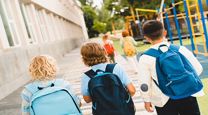 three children walking to school