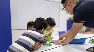 teacher-children-robotics-school-stock-image