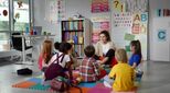 Image of young children sitting on floor in early years setting